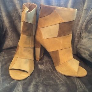 Torrid 10.5W Patchwork Booties 3.5 inch heel. Tried on but never worn.